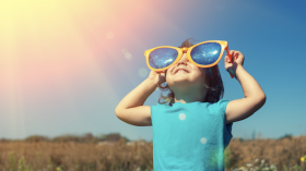 Sunny day, child with large sunglasses