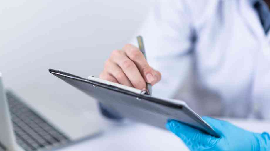 A doctor with a clipboard
